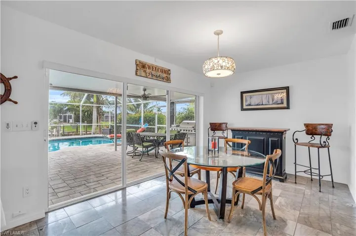 Dining space with visible vents and baseboards