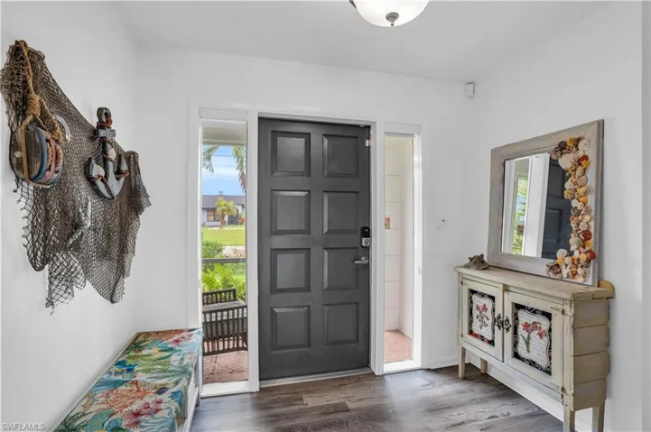 Entrance foyer with dark wood-style flooring