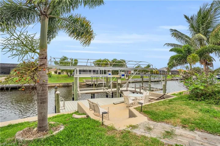 Dock area featuring a water view and boat lift