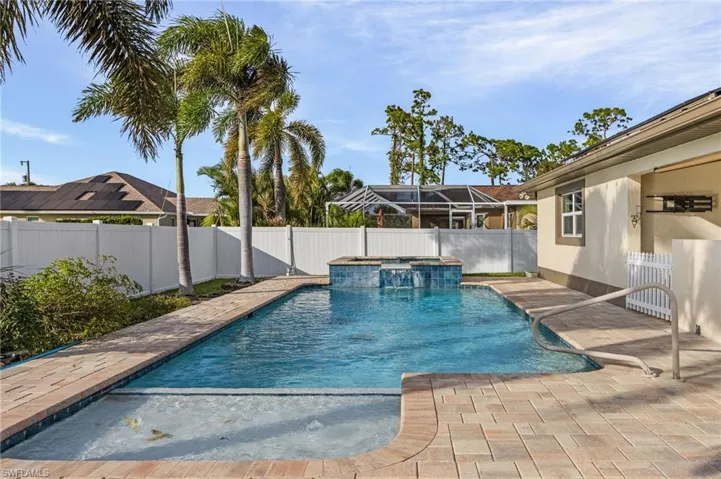 View of pool featuring a patio and a lanai