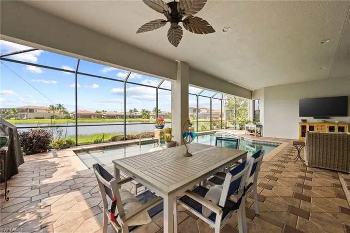 View of patio / terrace with ceiling fan and glass enclosure