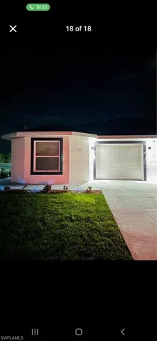 Single story home featuring a front yard and stucco siding