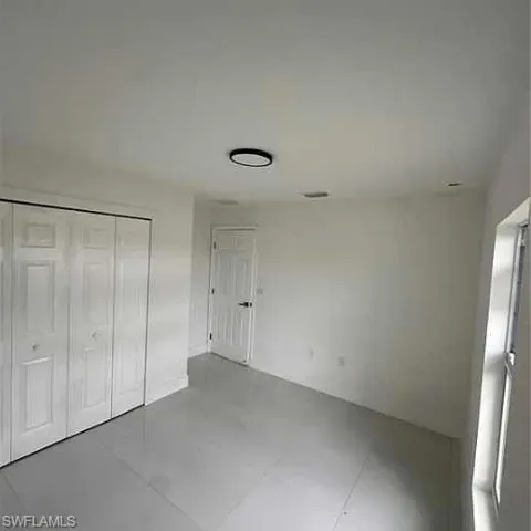 Unfurnished bedroom with a closet