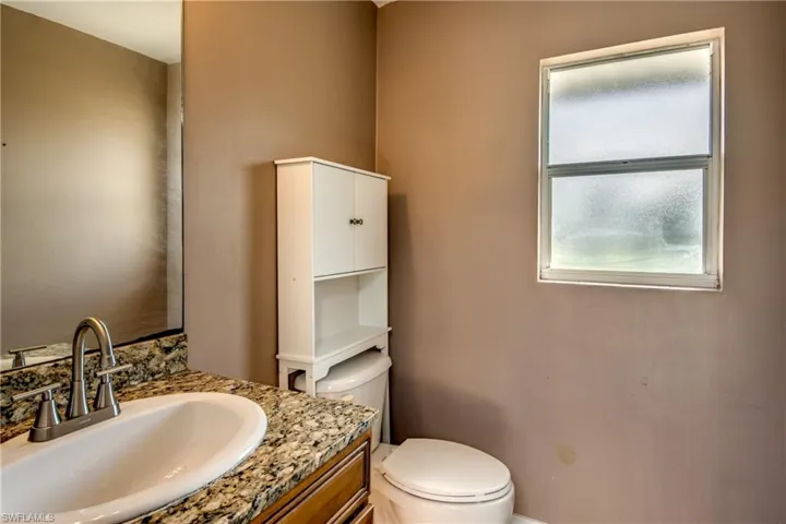 Bathroom with vanity and toilet
