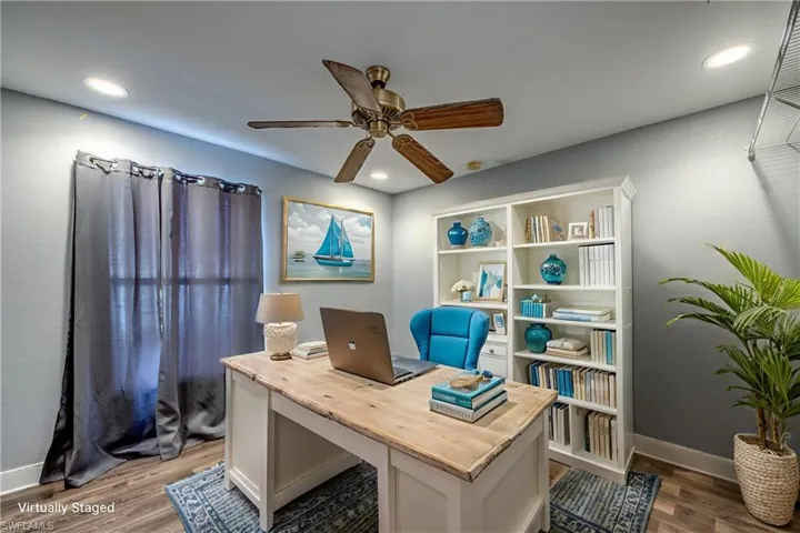Office area featuring a ceiling fan, dark wood finished floors, and recessed lighting