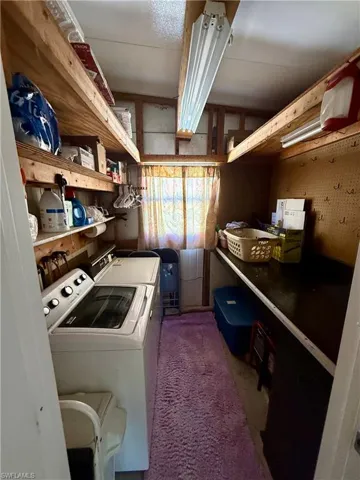 Laundry area featuring separate washer and dryer