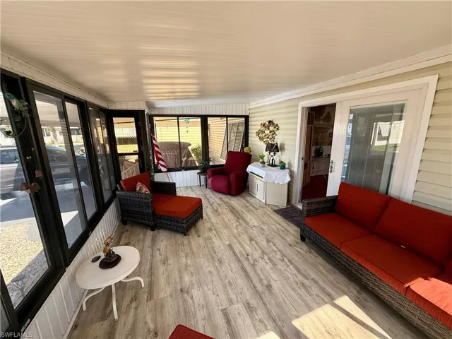 Sunroom / solarium with wood finished floors