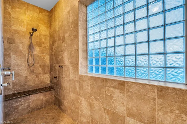 Master bathroom featuring a large walk-in tile shower