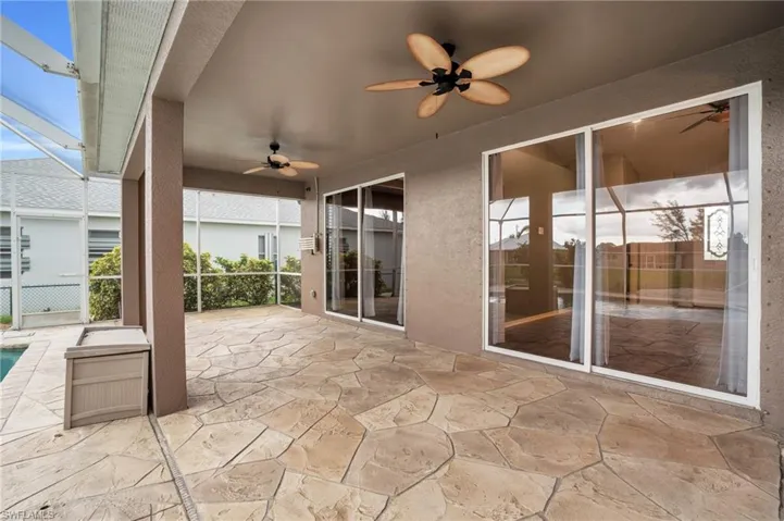 View of patio / terrace with ceiling fans