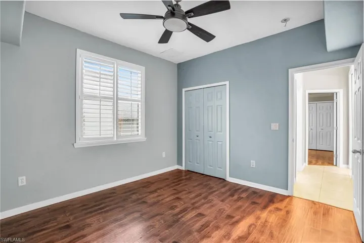 Guest bedroom #1 bedroom with ceiling fan, and vinyl wood like floors