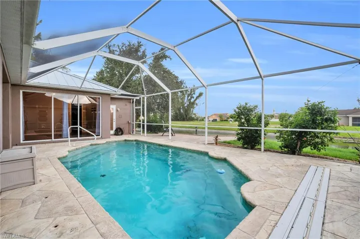 View of pool featuring a patio area and a lanai