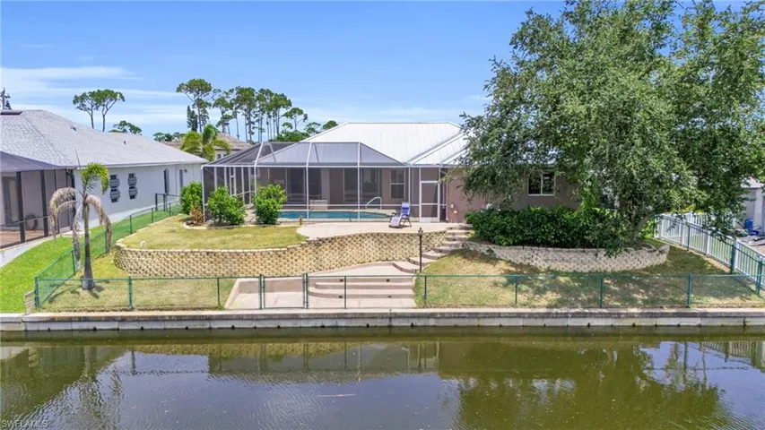 Rear view of property with a water view