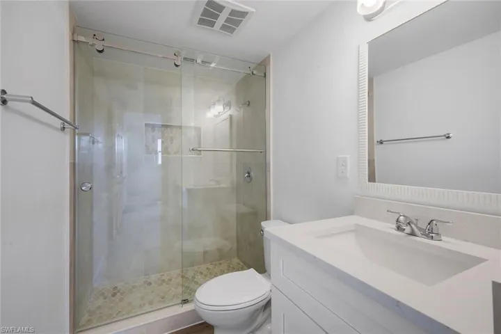 Ensuite primary bathroom features a walk-in shower.