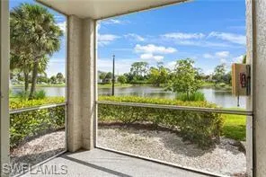 Unfurnished sunroom featuring a water view