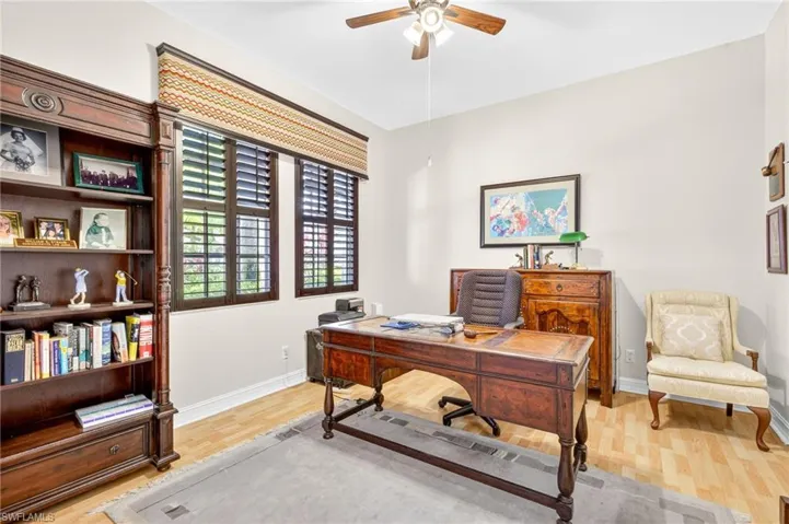 This 4th bedroom with french doors is set up like an office/den.