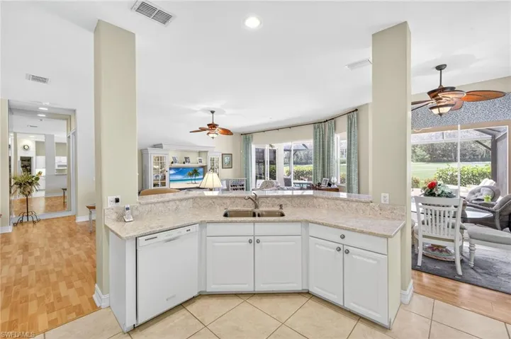 The kitchen features granite counter tops and under counter lighting.