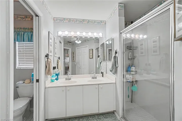 Main bath with double sinks and shower