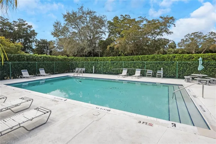 Community pool featuring a patio area