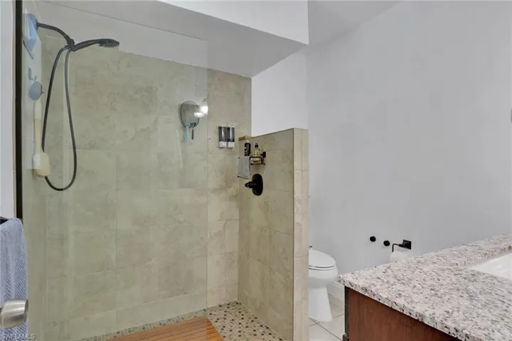 Full bath with vanity and a walk in shower