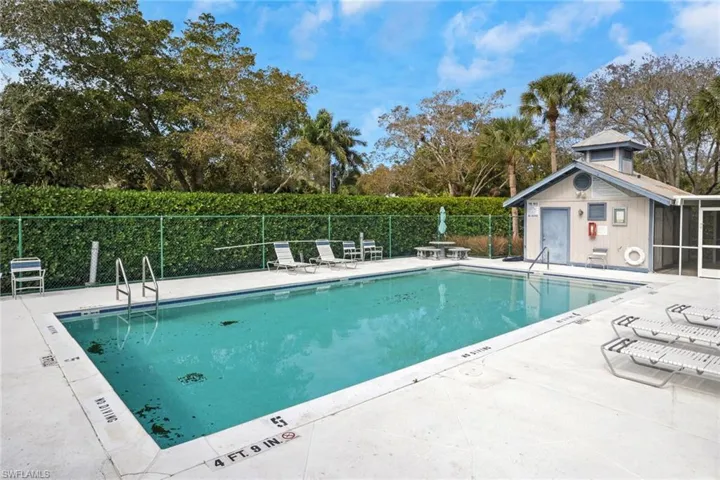 Community pool featuring a patio