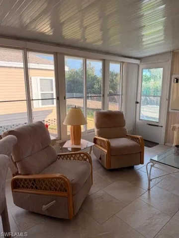 Sunroom featuring french doors