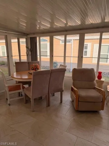 Sunroom featuring healthy amount of natural light