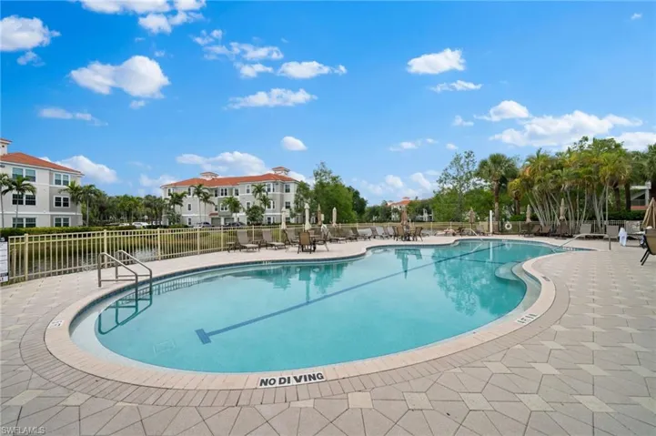 Community pool with a patio area