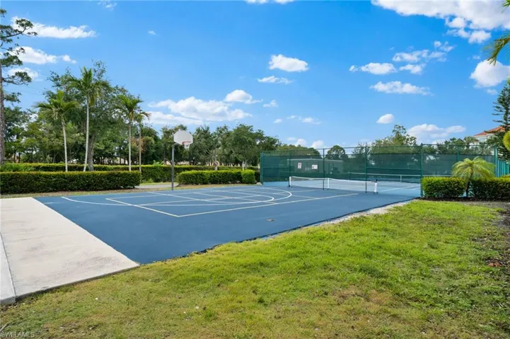 View of sport court featuring community basketball court and a tennis court