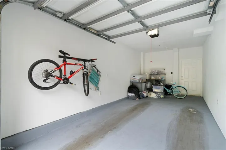 Garage featuring a garage door opener