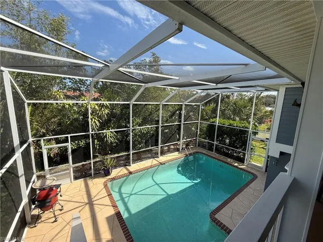 Pool featuring a patio area and a lanai