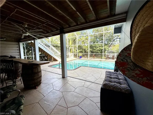 Outdoor pool area with secondary entertainment space.