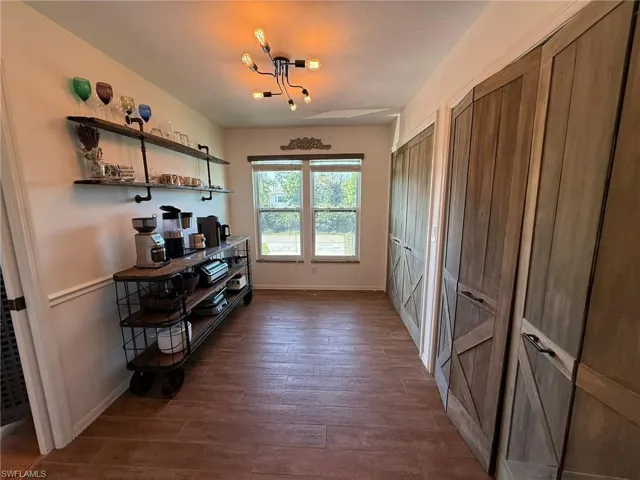 Laundry area, pantry, and coffee bar