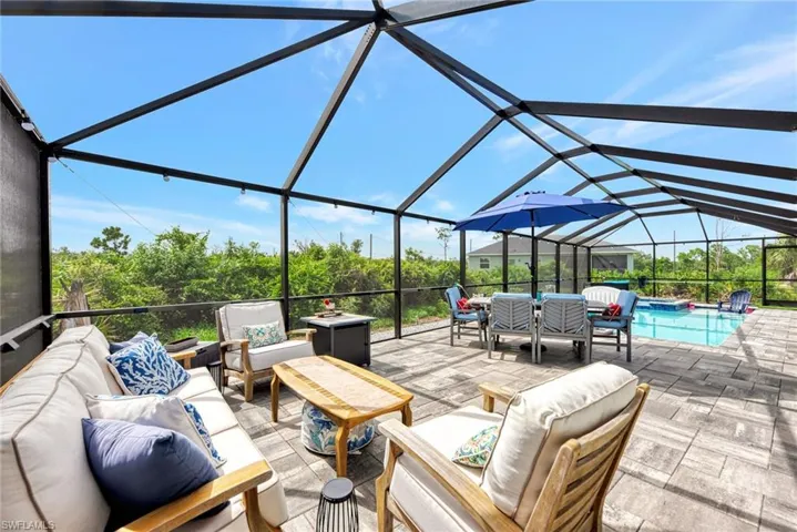 Sunroom featuring vaulted ceiling