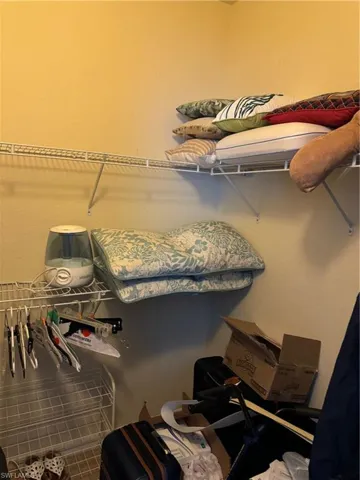 Walk in closet featuring tile flooring