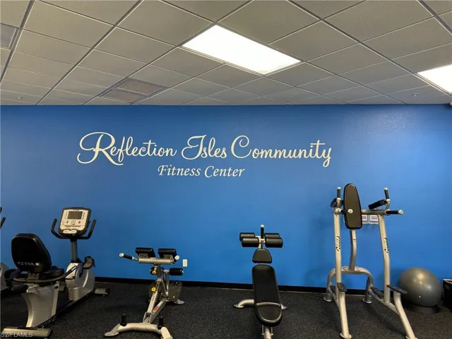 Gym with a paneled ceiling
