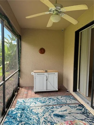 Unfurnished screened lanai with ceiling fan