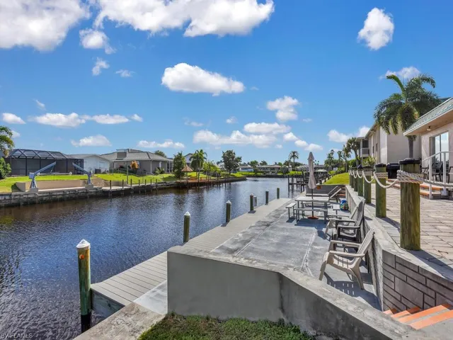 Dock featuring a residential view and a water view