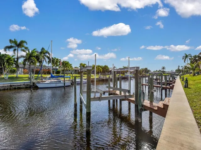 Dock area featuring a water view and boat lift