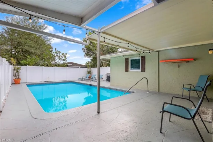 View of swimming pool with a patio