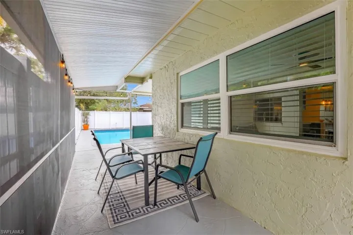 View of patio / terrace with a fenced in pool