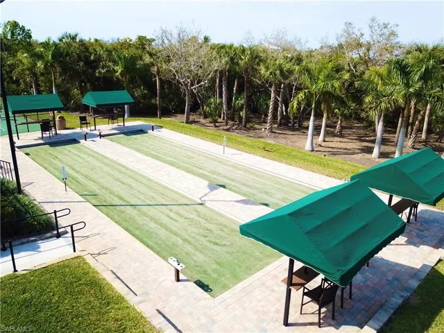 Bocce ball courts with synthetic turf playing surfaces and paver surrounds