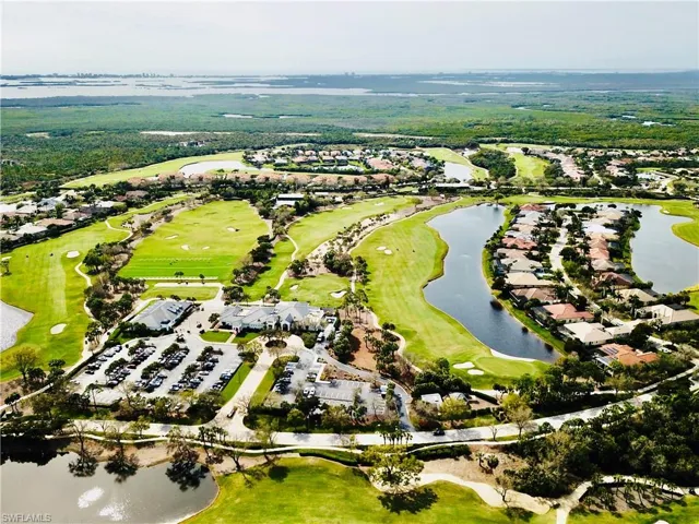 Expansive aerial perspective showcasing a golf course community