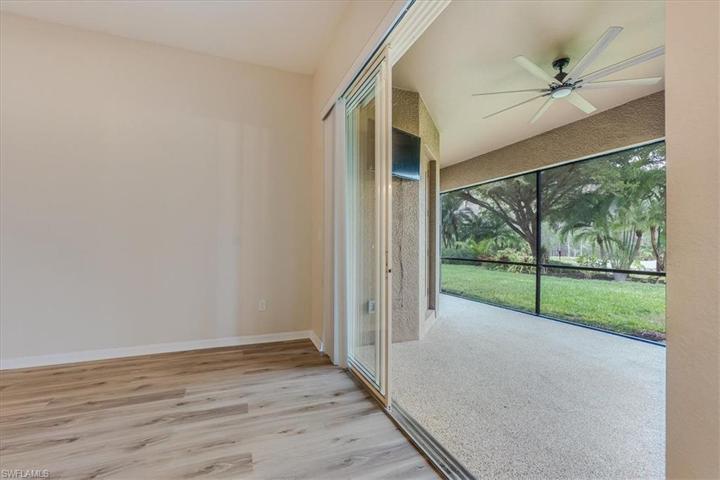 Slider to screened in lanai from formal living space.