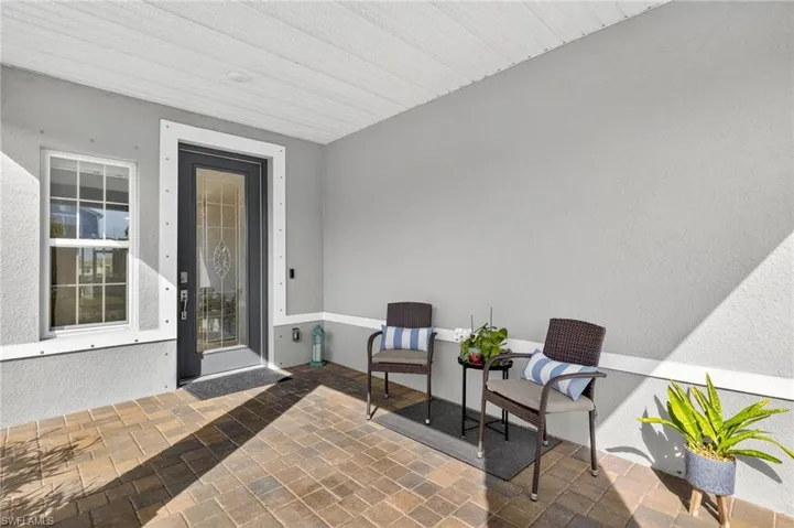 Office area with light tile patterned flooring and ceiling fan