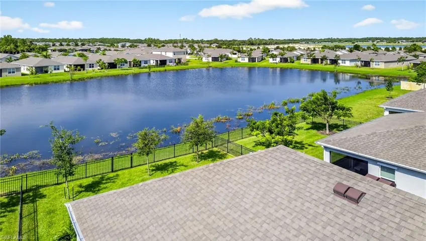 Bird's eye view of a heavily wooded area and a large body of water
