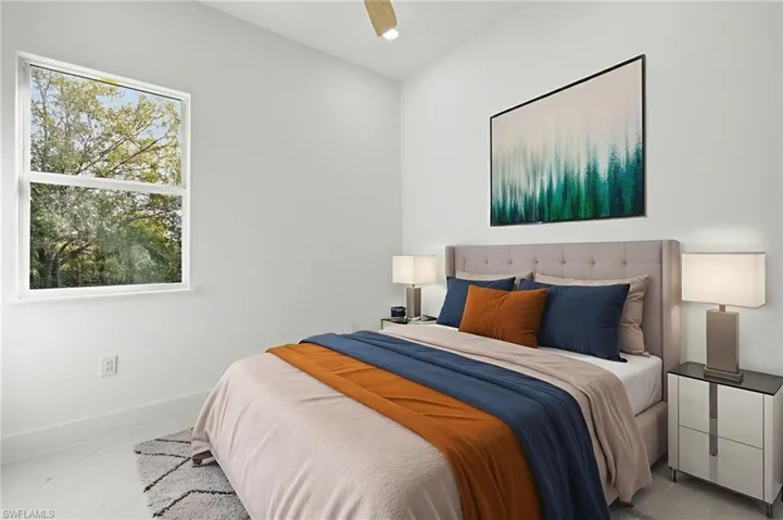 Tiled bedroom featuring ceiling fan and recessed lighting