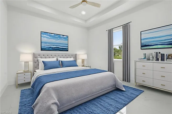 Bedroom featuring a raised ceiling, a ceiling fan, and recessed lighting