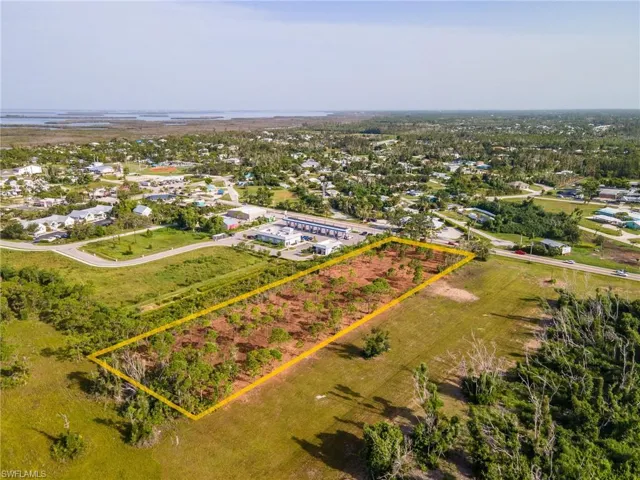 Overview of rural landscape with property parcel outlined and abundant farmland