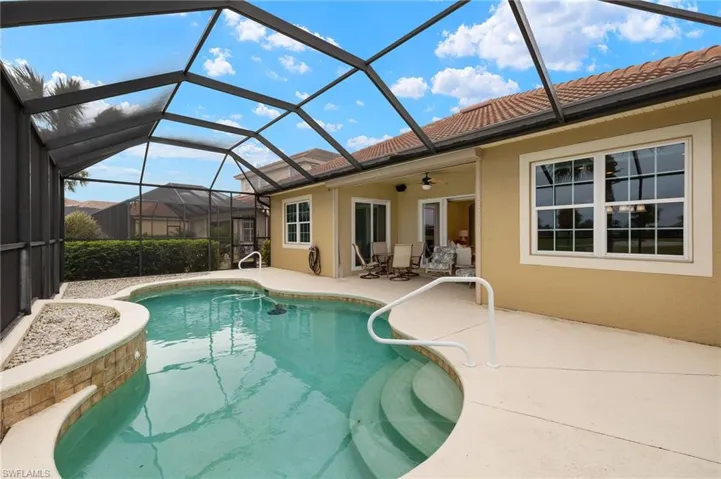 View of pool featuring a patio, a lanai, and ceiling fan