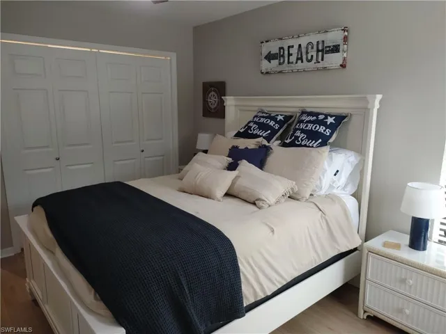 Bedroom with a closet and wood finished floors